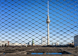 View through a grate on the roof terrace of the New City Palace to the TV Tower at Alexanderplatz