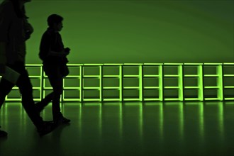 Visitors in front of green light installation in Pinakothek der Moderne