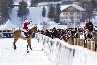Nacho Gonzalez of Team St. Moritz stands with his horse at the rail and welcomes the spectators