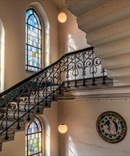 Staircase corridor with decorative windows in Sankt Hedwig Hospital