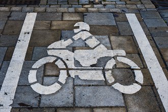 Parking space marking on pavement with motorbike pictogram in Kempten Allgaeu