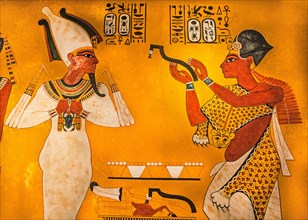 Ritual mouth opening ceremony on Tutankhamun in representation of Osiris by Eje
