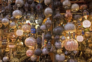 Ornate copper-forged lamps in the souks of Fes