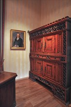 Carved chest cabinet from the 19th century in the study