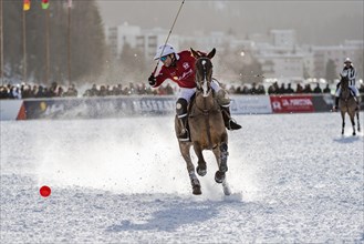 Nacho Gonzalez of Team St. Moritz tries to hit the ball at full gallop