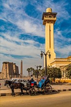 New Mosque with horse-drawn carriage in front of Luxor Temple