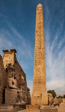 Entrance pylon flanked by two colossal statues of Ramses and obelisk