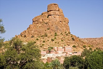 Village in front of bizarre granite rocks