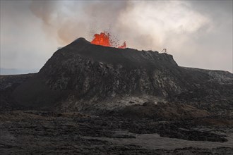 Lava fountain spraying from crater