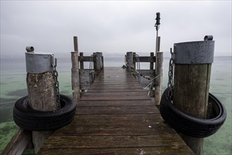 Empty shipping pier in autumn rain