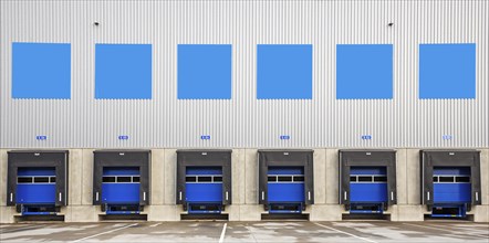 6 blue loading ramps at warehouse