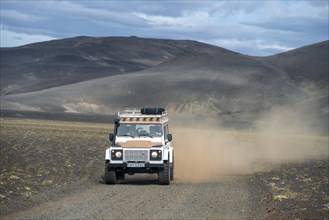 Land Rover Defender on gravel road