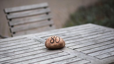 Stone with table number on a garden table