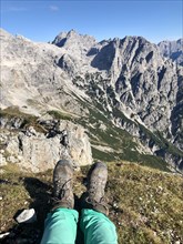 Hiking boots in front of mountain panorama