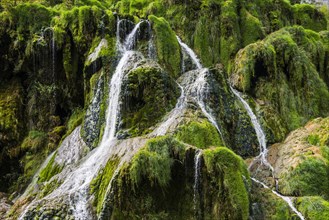 Waterfall and moss-covered rocks