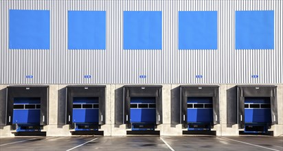 5 blue loading ramps at warehouse