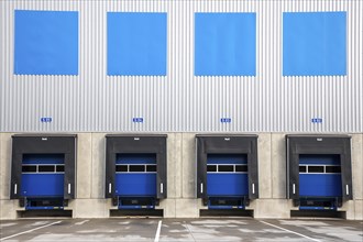4 blue loading ramps at warehouse