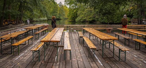 Tables and benches in an empty beer garden in the park