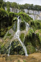 Waterfall and moss-covered rocks