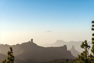 View from the highest peak of Gran Canaria to Roque Nublo peak and volcano El Teide on neighboring island Tenerife