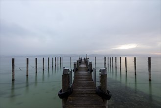 Empty shipping pier in autumn rain