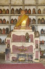Historic old statue of Buddhist monk in Buddhist monastery