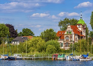 Church and residential buildings on Lake Schwielow near Werder