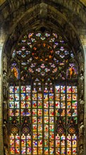 14th century Milan Cathedral stained glass windows in white marble