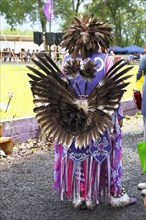 Indian with colorful dress at a Pow Wow