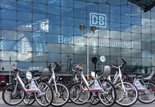 Parked rental bikes in front of the entrance to the main station