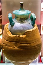 Terracotta urn with glass jar inside
