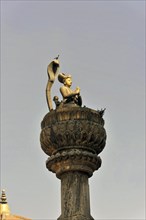 Statue of King Yoganarendra Malla with snake and bird
