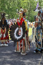 Native Americans with colorful dress at a Pow Wow