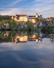 Colditz Castle reflected in the river Zwickauer Mulde