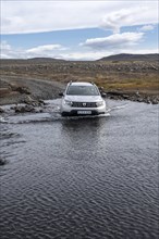 Dacia Duster 4x4 car crossing a river