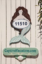 House number with mermaid of a villa on Sanibel Island/ house number
