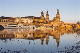 City view in the morning light with reflection in the river Elbe