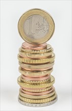 Stack of cent coins and euro coins