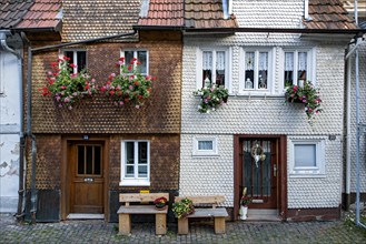 Historic shingle houses decorated with flowers