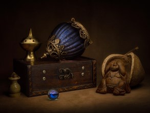 Still life with incense holder and oriental hanging lamp on wooden box