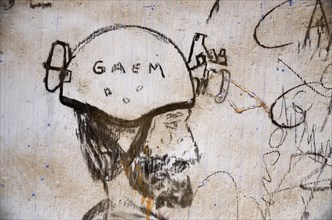 Charcoal Drawing of Head with Motorcycle Helmet on White Wall