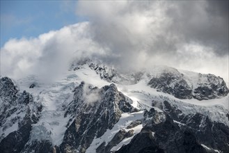Cloud-covered mountain with snow and glacier