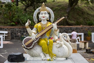 Statue of Goddess Saraswati at the sacred lake of Ganga Talao in the south of the island of Mauritius