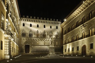 Night view of Piazza Salimbeni with statue of Sallustio Bandini