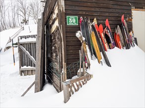 Old skis in the snow at the Ardning Alm Hut