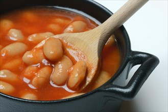 White beans with tomato sauce in pots