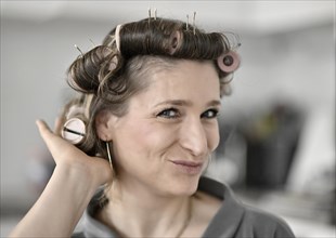 Woman with curlers