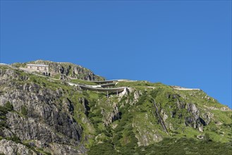 Mountain massif of the Rhone glacier with serpentines of the Furka Pass road