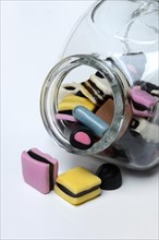 Liquorice sweets in glass container