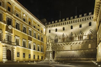 Night view of Piazza Salimbeni with statue of Sallustio Bandini